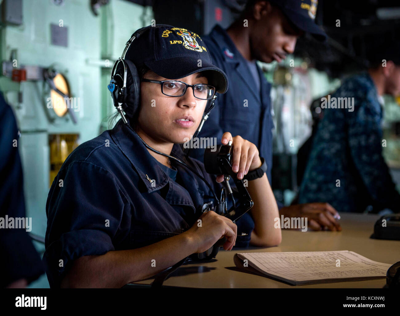 171007-N-YL073-0133   MAYPORT, Fla., (Oct. 7, 2017) Quartermaster 3rd Class Mary Hinojosa, a native of San Antonio, communicates with bearing takers on the bridge aboard the amphibious transport dock ship USS New York (LPD 21) during sea and anchor evolutions.  New York departed Naval Station Mayport, Florida, to support the Gulf coast region in the event assistance is needed in the wake of Hurricane Nate. (U.S. Navy photo by Mass Communication Specialist 1st Class Shamira Purifoy/Released) Stock Photo