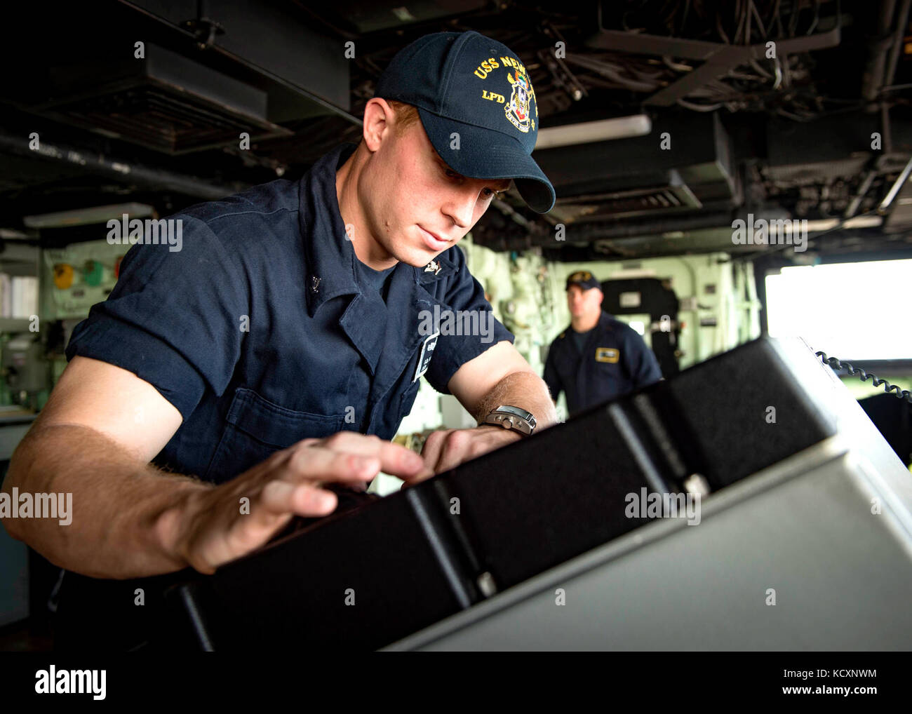 171007-N-YL073-0155   MAYPORT, Fla., (Oct. 7, 2017) Operations Specialist 3rd Class Stephen Williams, of Oscala, Florida , operates a navigation scope on the bridge aboard the amphibious transport dock ship USS New York (LPD 21) during sea and anchor evolutions. New York departed Naval Station Mayport, Florida, to support the Gulf coast region in the event assistance is needed in the wake of Hurricane Nate. (U.S. Navy photo by Mass Communication Specialist 1st Class Shamira Purifoy/Released) Stock Photo