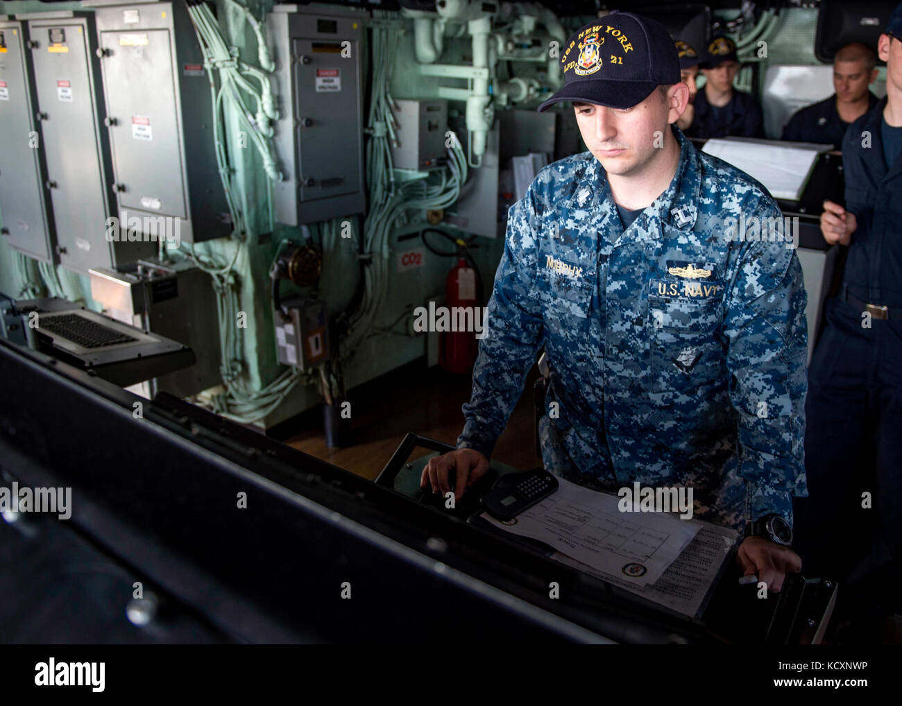 171007-N-YL073-0177   MAYPORT, Fla., (Oct. 7, 2017) Lt. j.g. Michael Murphy, a native of Lebanon, Tennessee, stands the navigator evaluator watch on the bridge aboard the amphibious transport dock ship USS New York (LPD 21) during sea and anchor evolutions. New York departed Naval Station Mayport, Florida, to support the Gulf coast region in the event assistance is needed in the wake of Hurricane Nate. (U.S. Navy photo by Mass Communication Specialist 1st Class Shamira Purifoy/Released) Stock Photo