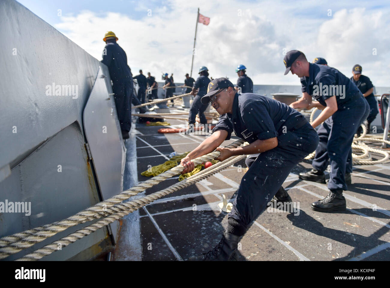 171007-N-PC620-0022  MAYPORT, Fla. (Oct. 7, 2017) Seaman Taechawn Edmonson,  a native of Canton, Ohio, heaves a mooring line during sea-and-anchor evolutions aboard the amphibious transport dock ship USS New York (LPD 21). New York departed Naval Station Mayport, Florida, to support the Gulf coast region in the event assistance is needed in the wake of Hurricane Nate. (U.S. Navy photo by Mass Communication Specialist Seaman Michael Lehman/Released) Stock Photo