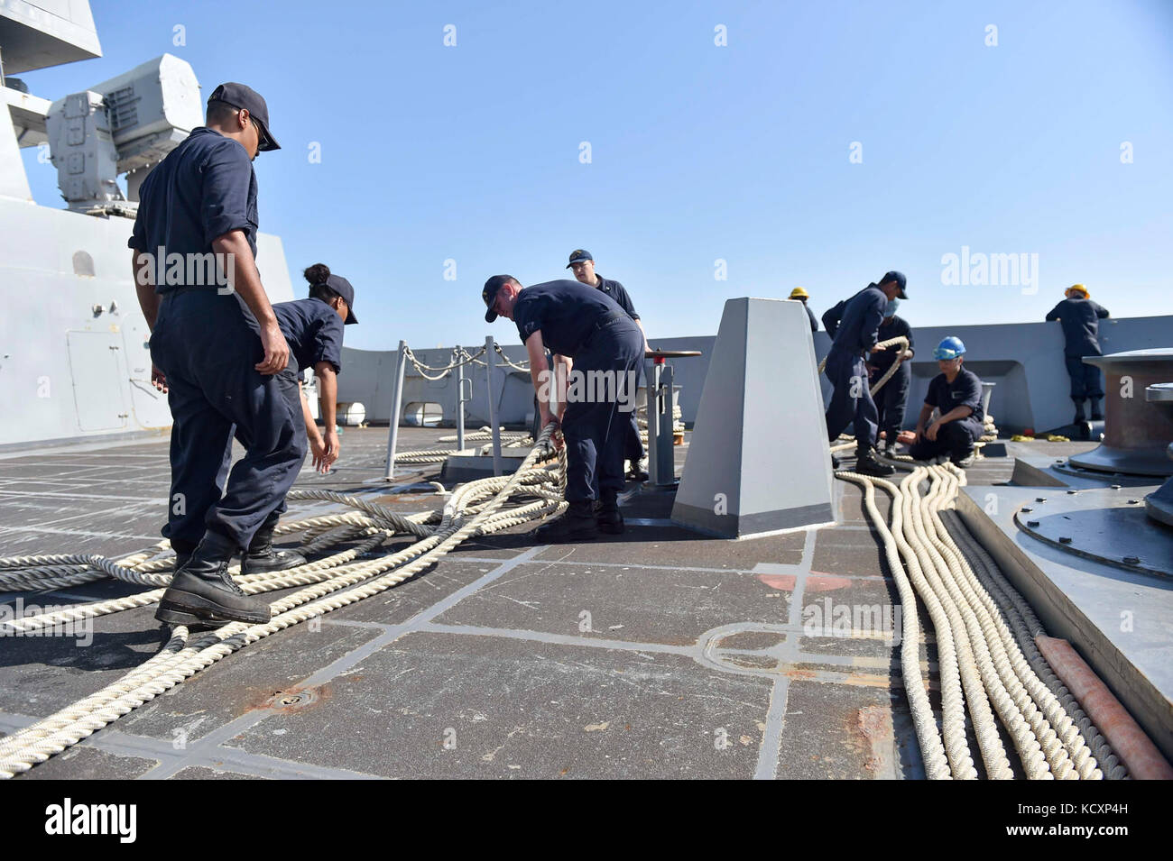 171007-N-PC620-0030  MAYPORT, Fla. (Oct. 7, 2017) Sailors assigned to the amphibious transport dock ship USS New York (LPD 21) fake down and inspect mooring lines during sea-and-anchor evolutions. New York departed Naval Station Mayport, Florida, to support the Gulf coast region in the event assistance is needed in the wake of Hurricane Nate. (U.S. Navy photo by Mass Communication Specialist Seaman Michael Lehman/Released) Stock Photo