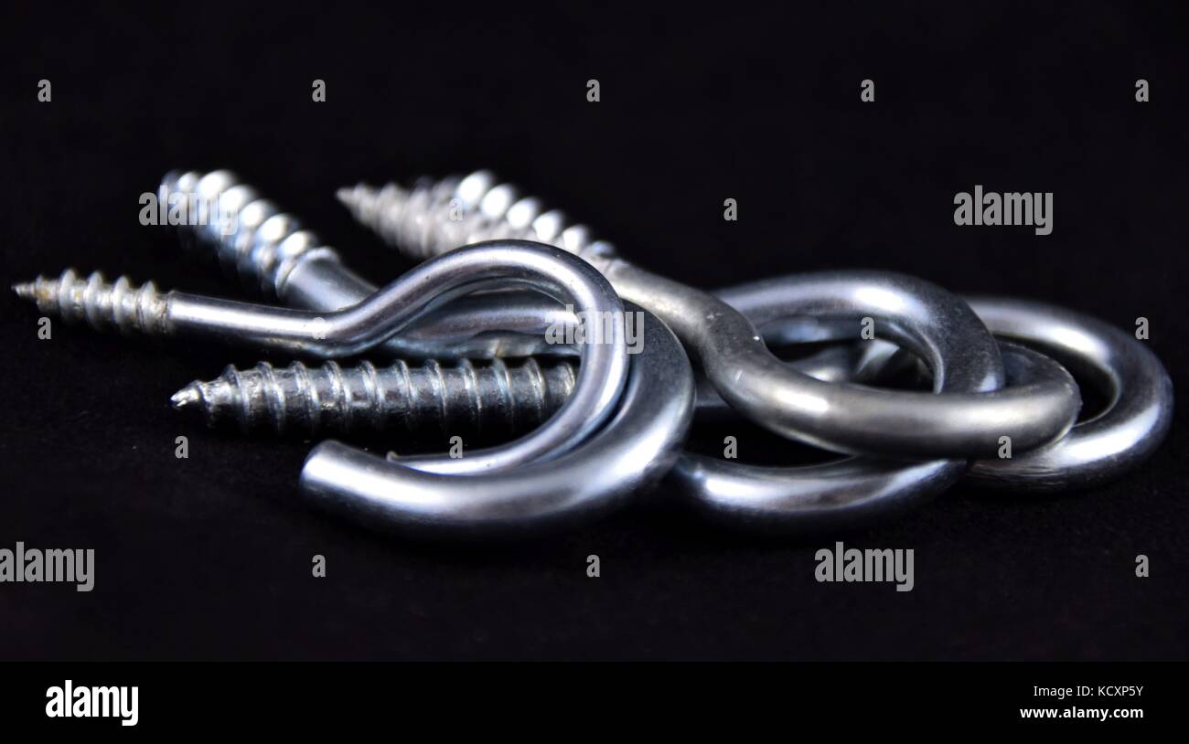 stainless steel hook with conical thread, a group of abstract metal ...