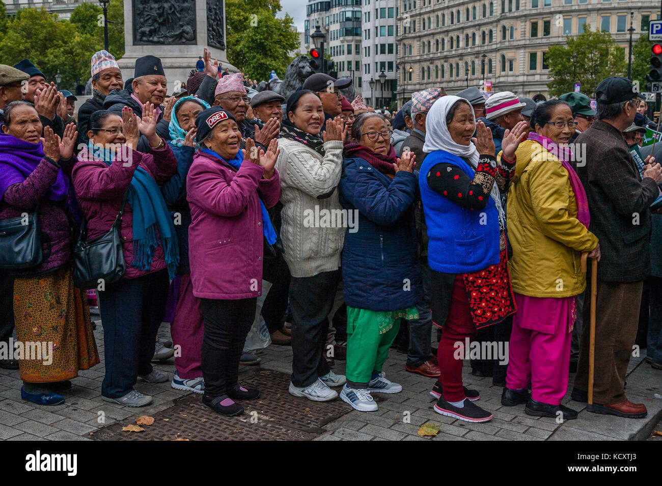 London, UK. 7th October 2017. Ghurkas and Nepali women clap football fans from across the Uk marching against extremism under the banner of the FLA (football lads alliance) Credit: Grant Rooney/Alamy Live News Stock Photo
