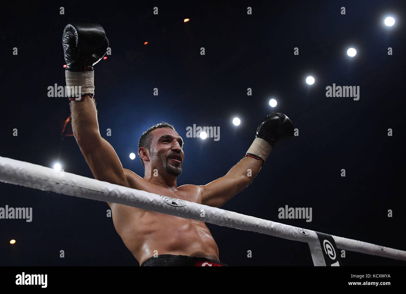 Stuttgart, Germany. 7th Oct, 2017. Firat Arslan celebrates his victory in the professional boxing match between Arslan from Germany and Valori from Argentina in Stuttgart, Germany, 7 October 2017. Credit: Marijan Murat/dpa/Alamy Live News Stock Photo