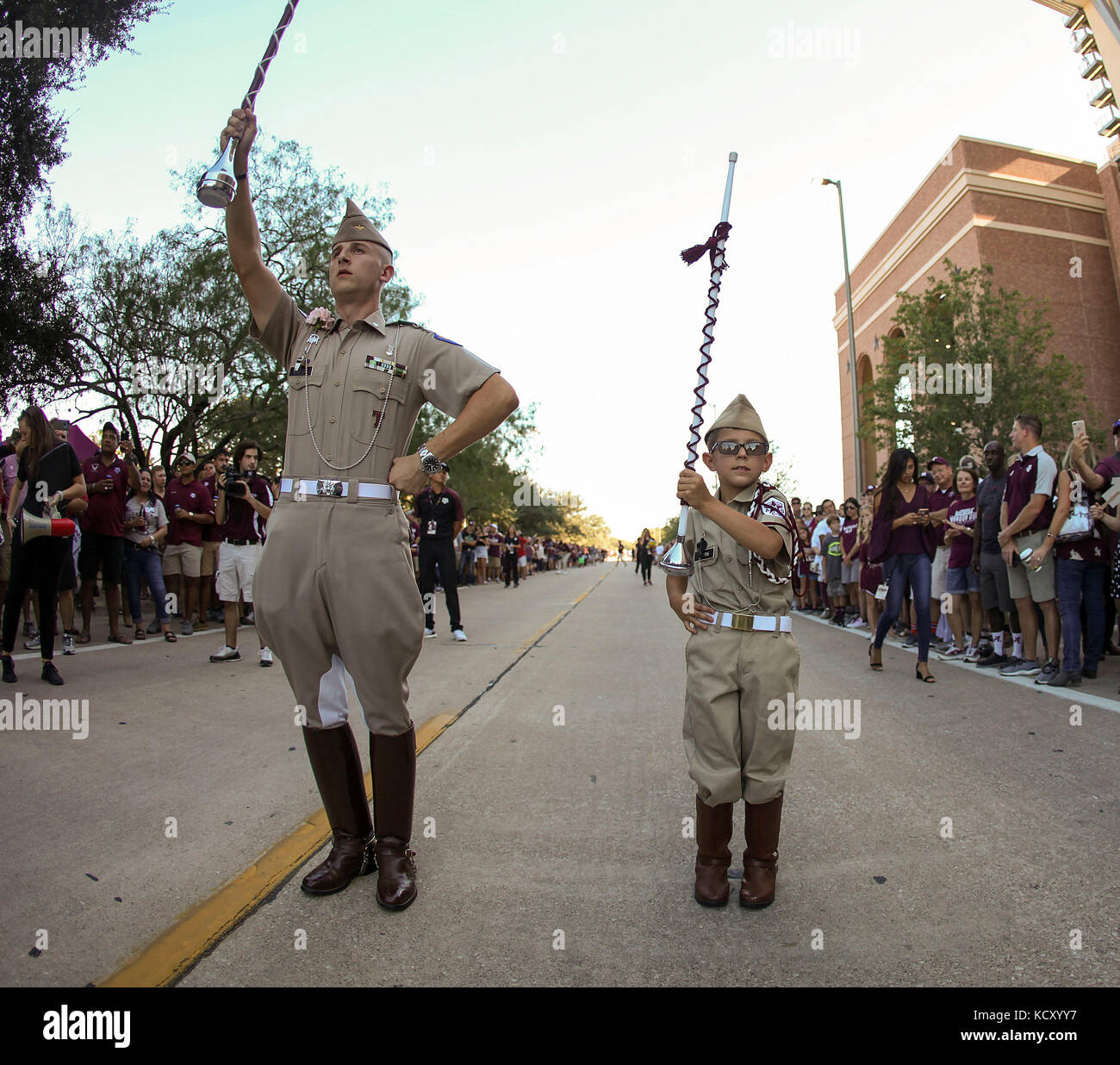 October 6, 2017: The Texas A&M Fighting Aggie band drum major and a young fan high lead the band in a song prior to the start of the NCAA football game between the Alabama Crimson Tide and the Texas A&M Aggies at Kyle Field in College Station, TX; John Glaser/CSM. Stock Photo