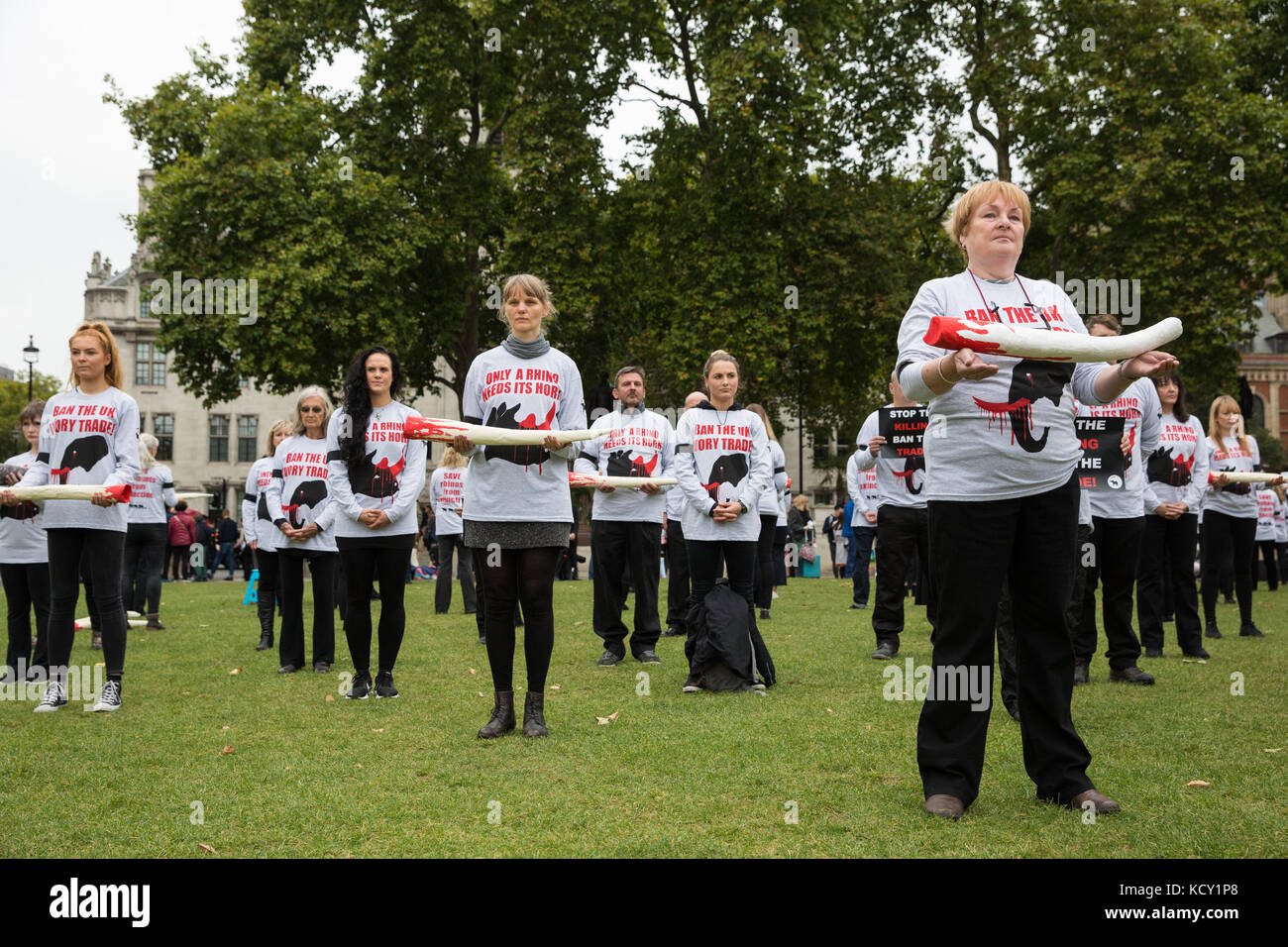 London, UK. 7th October, 2017. Campaigners against the ivory trade take part in a silent protest in Parliament Square to mark the fourth Global March for Elephants and Rhinos' March Against Extinction, intended not only to raise awareness of the plight of elephants and rhinos and the role of the antiques industry but also to apply pressure on the British Government to maintain a full ban on ivory. Credit: Mark Kerrison/Alamy Live News Stock Photo
