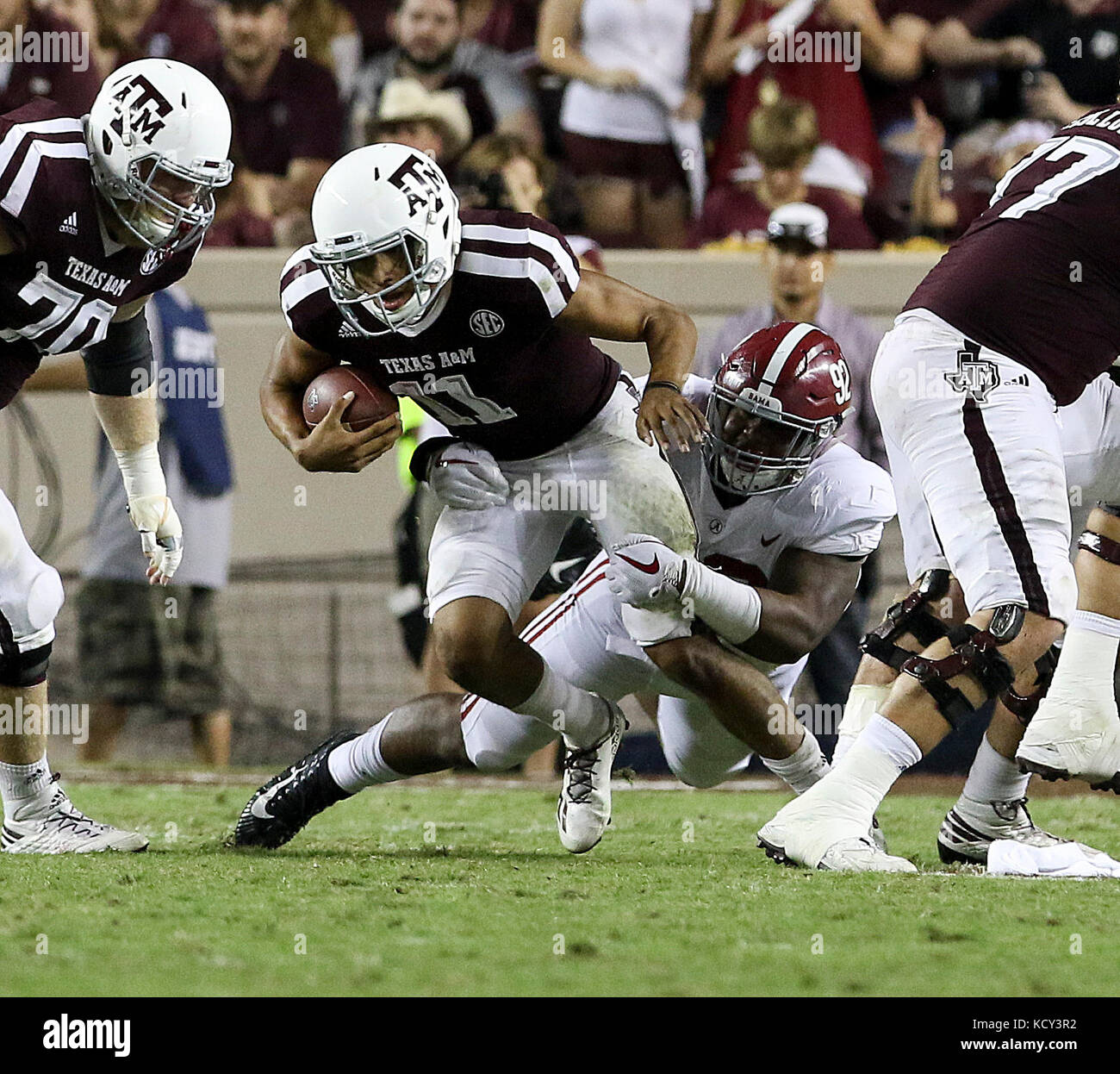 October 6, 2017: Texas A&M Aggies quarterback Kellen Mond (11) is tackled by Alabama Crimson Tide defensive lineman Quinnen Williams (92) in the fourth quarter during the NCAA football game between the Alabama Crimson Tide and the Texas A&M Aggies at Kyle Field in College Station, TX; John Glaser/CSM. Stock Photo