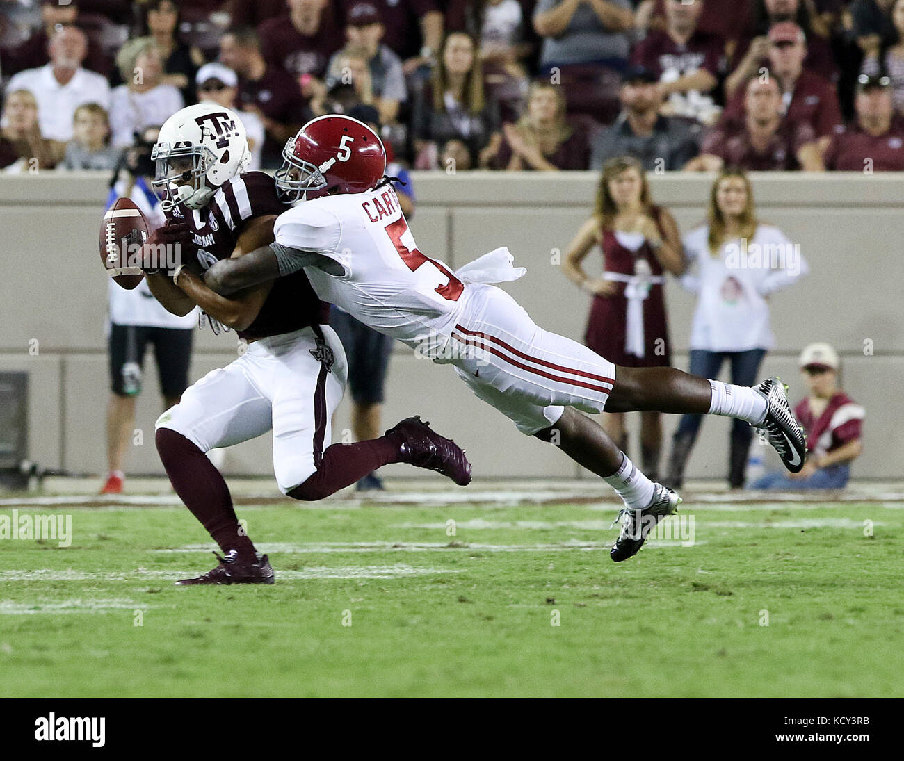 October 6, 2017: Alabama Crimson Tide defensive back Shyheim Carter (5) disrupts a pass to Texas A&M Aggies wide receiver Christian Kirk (3) in the third quarter during the NCAA football game between the Alabama Crimson Tide and the Texas A&M Aggies at Kyle Field in College Station, TX; John Glaser/CSM. Stock Photo