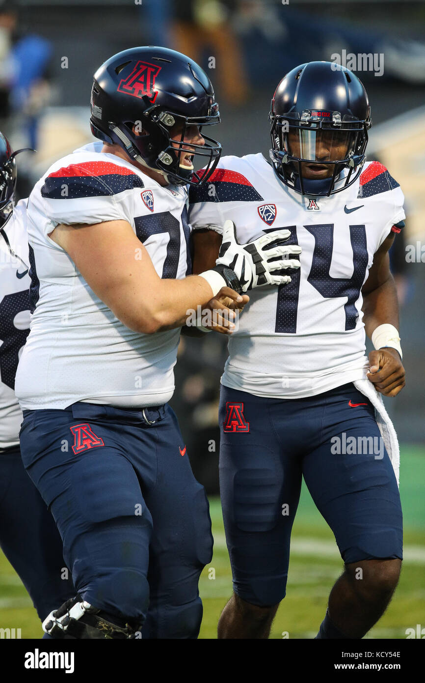 Boulder. 7th Oct, 2017. Arizona QB Khalil Tate (14) and offensive lineman Cody Creason celebrate the first of Tate's four rushing touchdowns against Colorado. He set an FBS record for rushing yards for a QB as the Wildcats won, 45-42, in Boulder. Credit: csm/Alamy Live News Stock Photo
