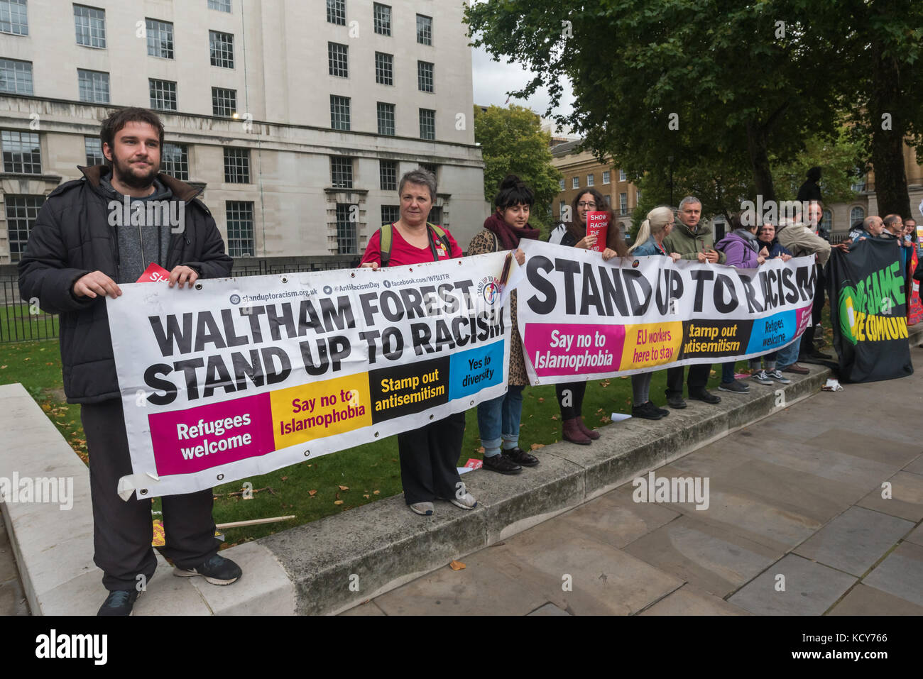 October 7, 2017 - London, UK. 7th October 2017. Police move in in large numbers to get marchers to move past Stand Up To Racism supporters handing out the flier 'Some questions for the leaders of the FLA' and continue their march . Although the FLA strongly denies accusations that they are racist and against Muslims in general, there were many former supporters of far-right groups such as the EDL among those marching. As the FLA marched past, a number of individuals came to shout abuse at those handing out the fliers, threatening them and photographers. One man pulled all of the fliers one p Stock Photo