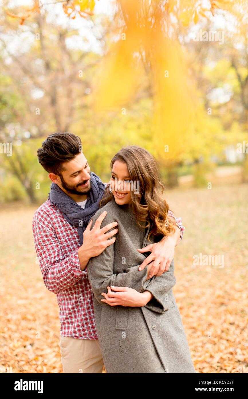 Young couple in love in the autumn forest Stock Photo - Alamy