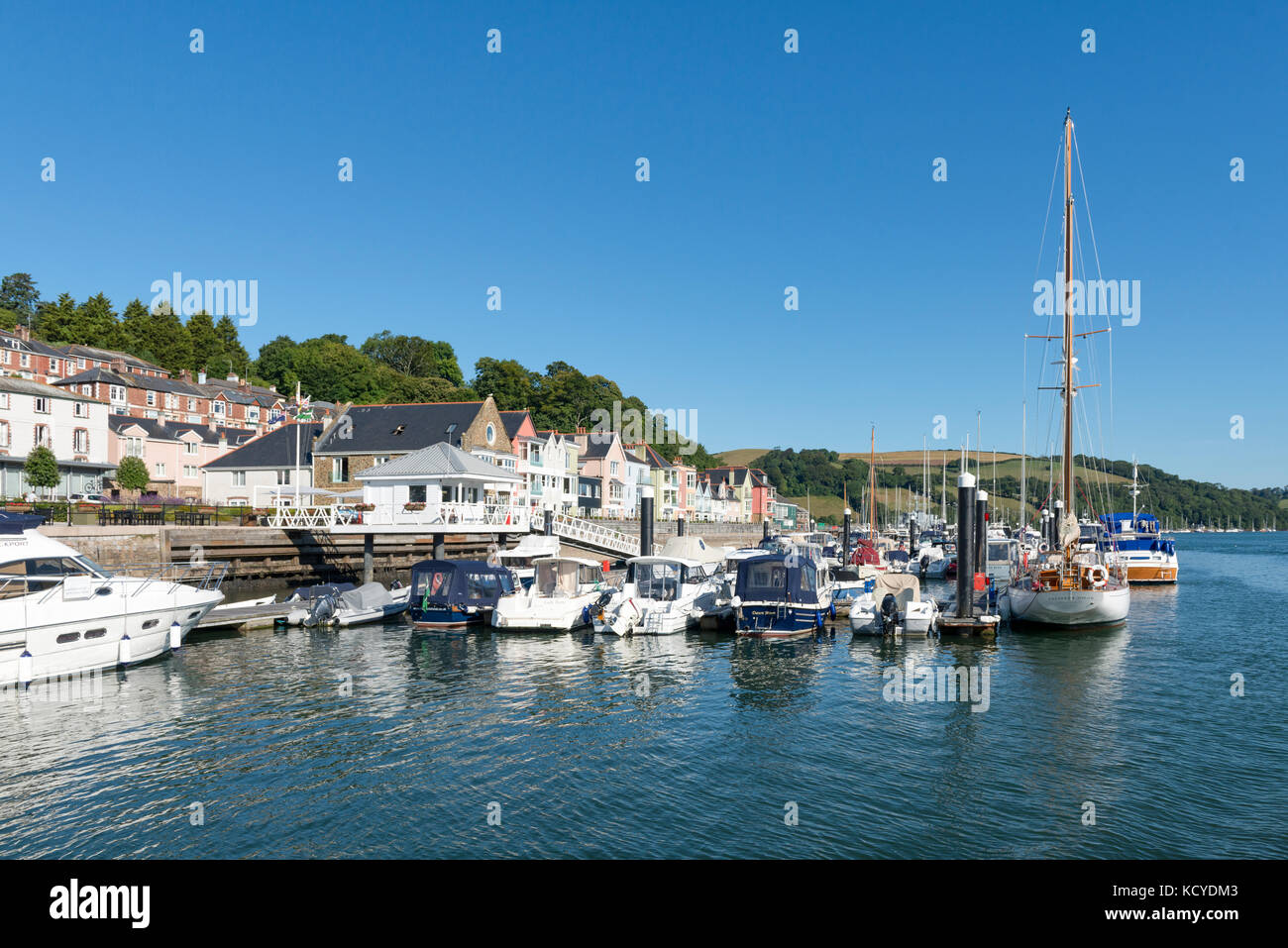 From the River Dart, Dartmouth, Devon - Dart Marina and Hotel with yachts and pleasure craft on water, hotel and buildings, trees and hills. Summer Stock Photo