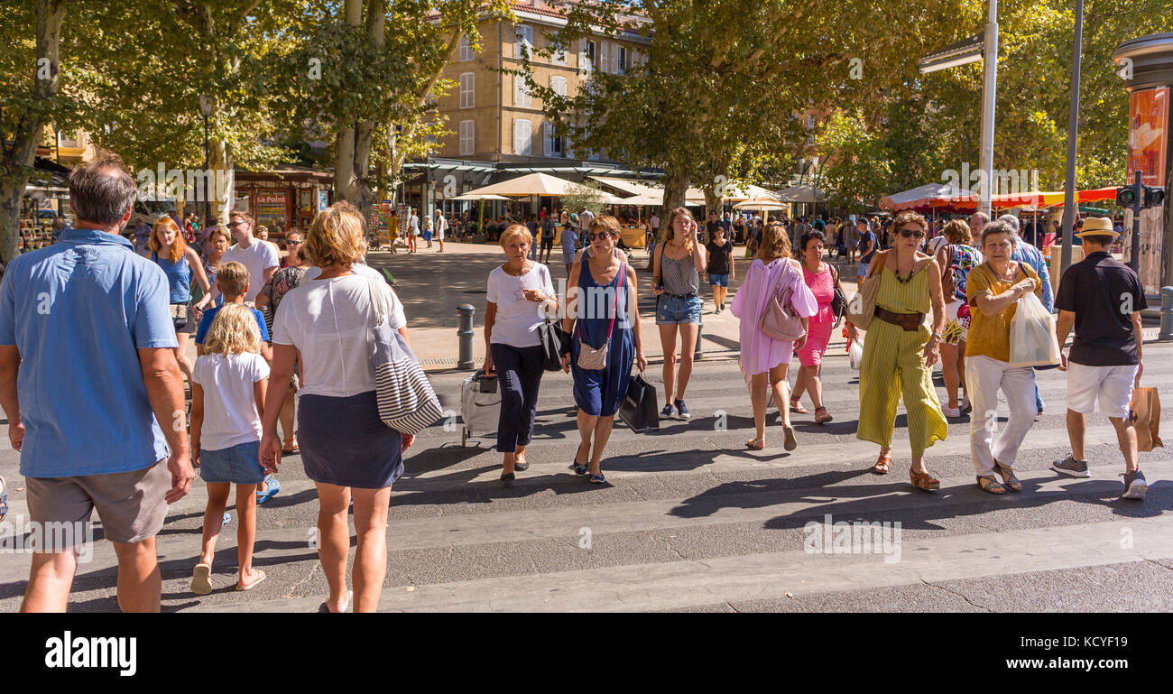 AIX-EN-PROVENCE, FRANCE - People crossing street at La Rotonde. Stock Photo