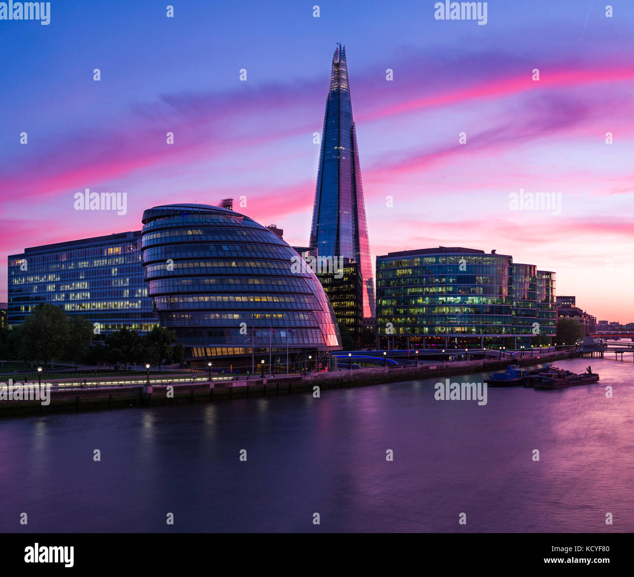 City Hall and The Shard at sunset with river Thames in foreground, London, United Kingdom Stock Photo