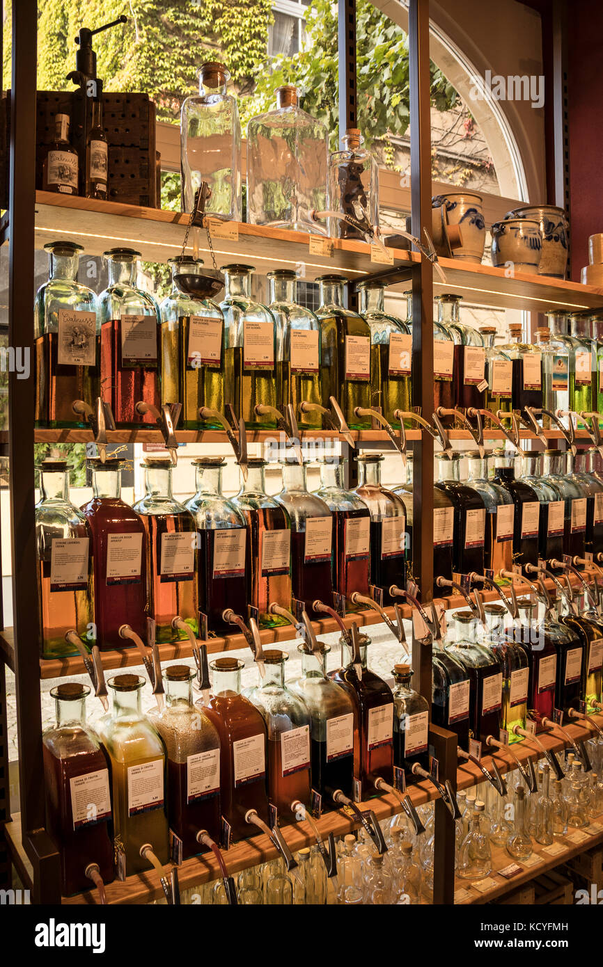 Dispensing bottles for Olive Oil, Wine and Whiskey, Liqueurs  etc in the shop of Walter J Oster in Bernkastel-Kues, in the Mosel Valley, Germany Stock Photo