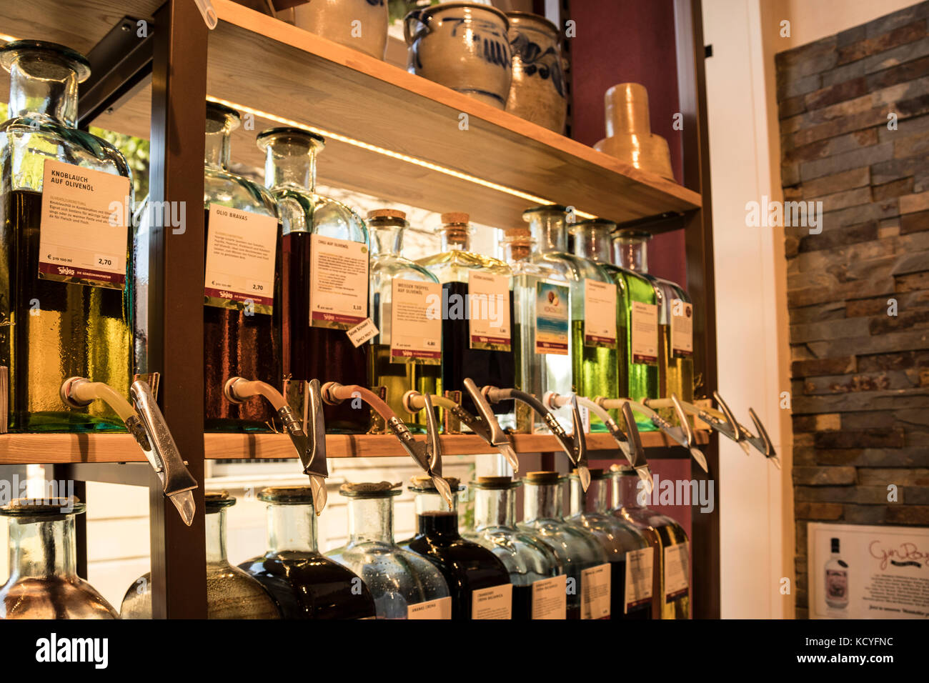 Dispensing bottles for Olive Oil, Wine and Whiskey, Liqueurs  etc in the shop of Walter J Oster in Bernkastel-Kues, in the Mosel Valley, Germany Stock Photo
