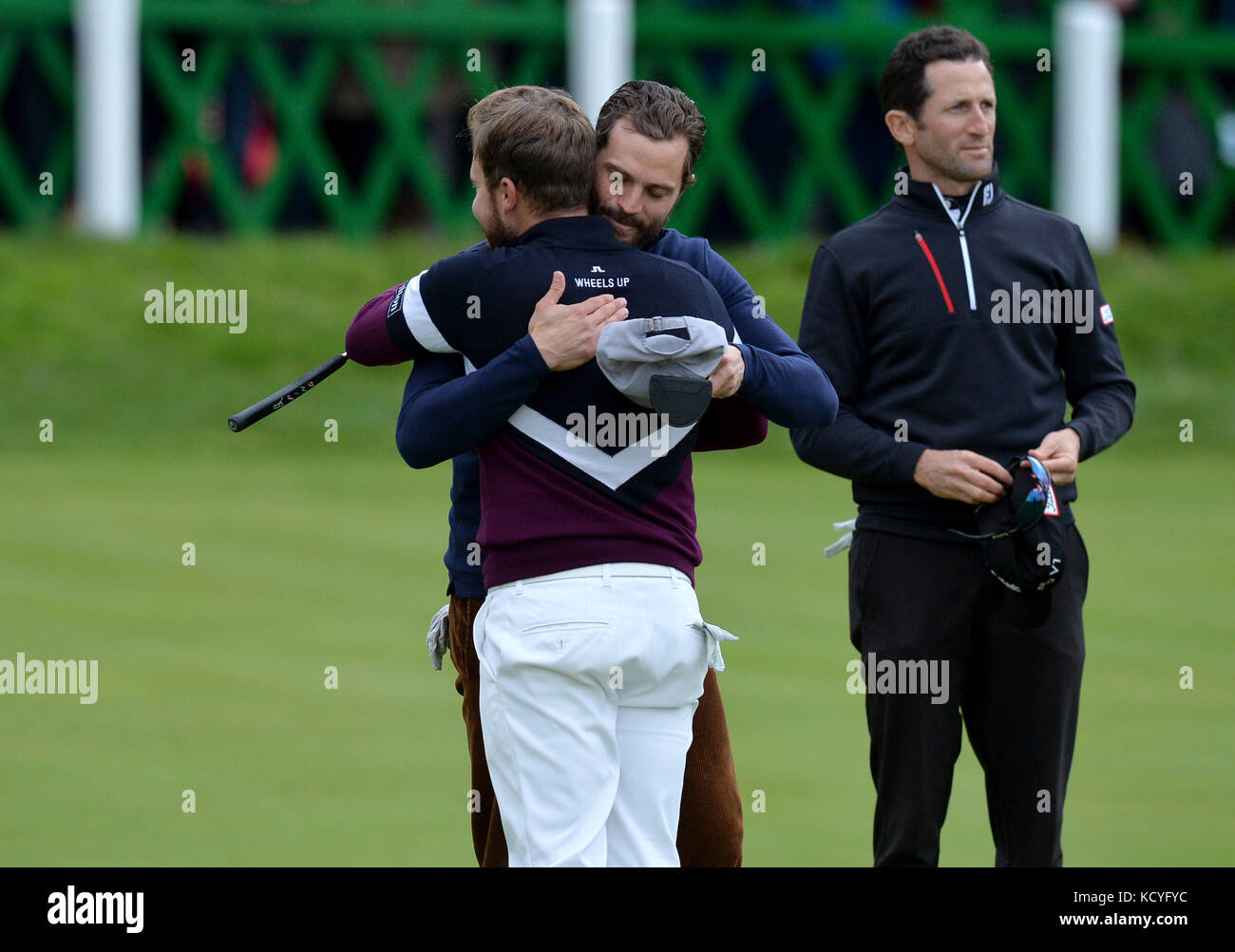 England's Tyrrell Hatton (left) recieves a hug from actor Jamie Dornan after winning the Alfred Dunhill Links Championship atSt Andrews Old Course, Fife. Stock Photo