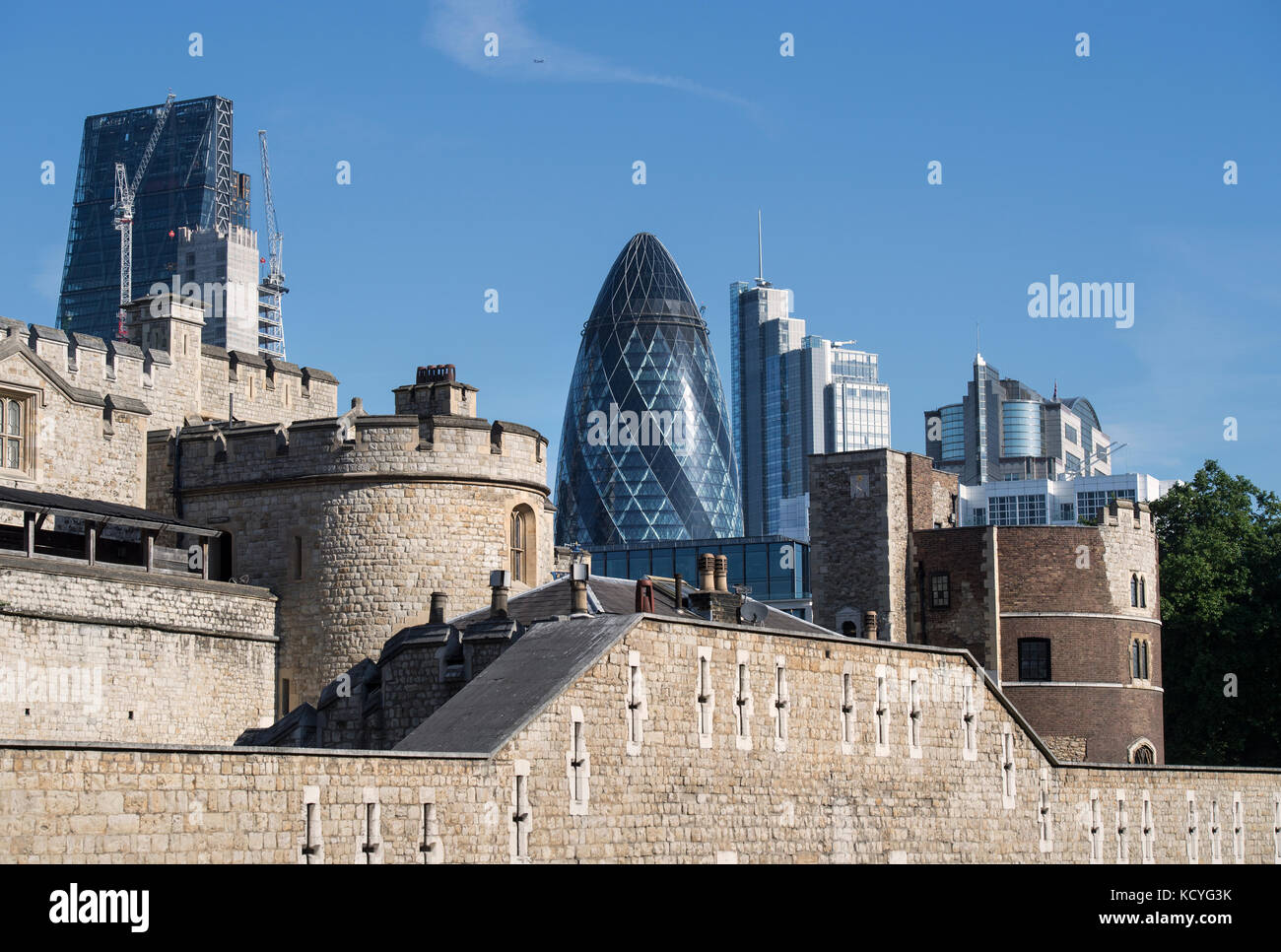 Walls of the Tower of London in London, England, UK, with the Gherkin