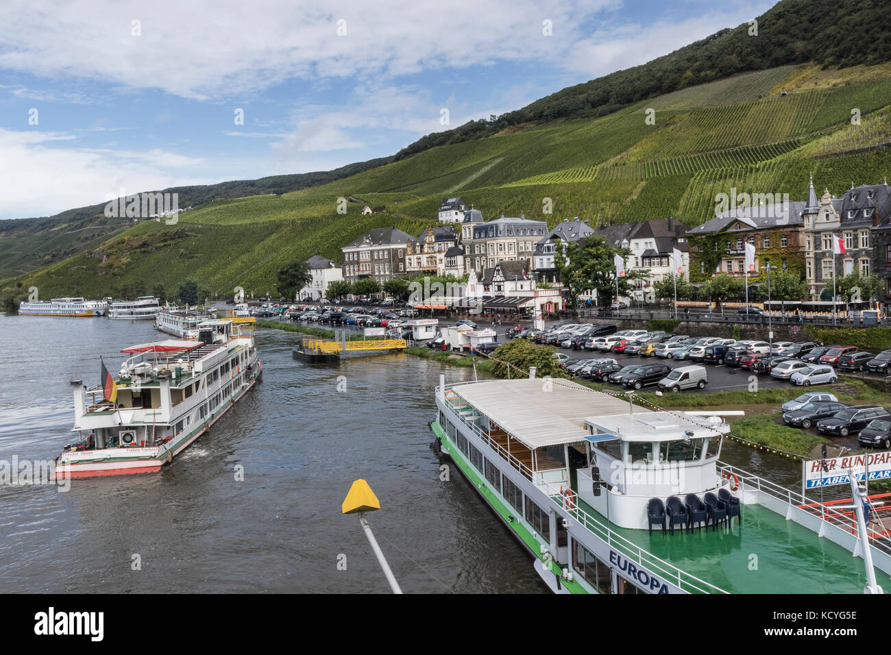 The town of Bernkastel-Kues, in the Mosel Valley, Germany with the passenger boats on the Mosel Riverriverside mooring Stock Photo