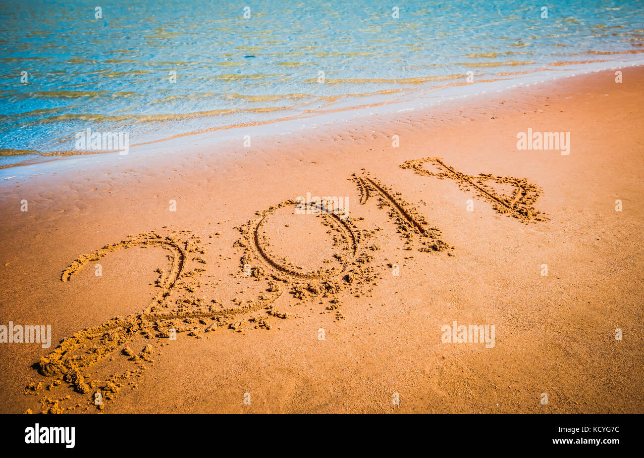 New Year 2018 coming concept. Digits on sand beach Stock Photo