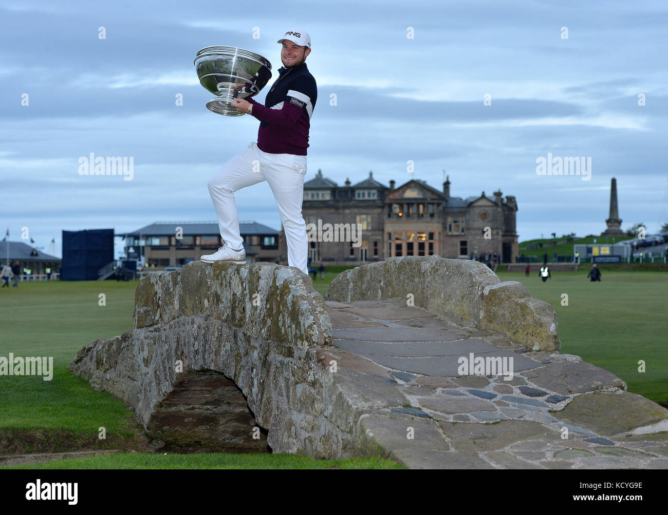 England's Tyrrell Hatton poses with the trophy on the Swilken bridge after winning during day four of the Alfred Dunhill Links Championship at St Andrews Old Course, Fife. Stock Photo