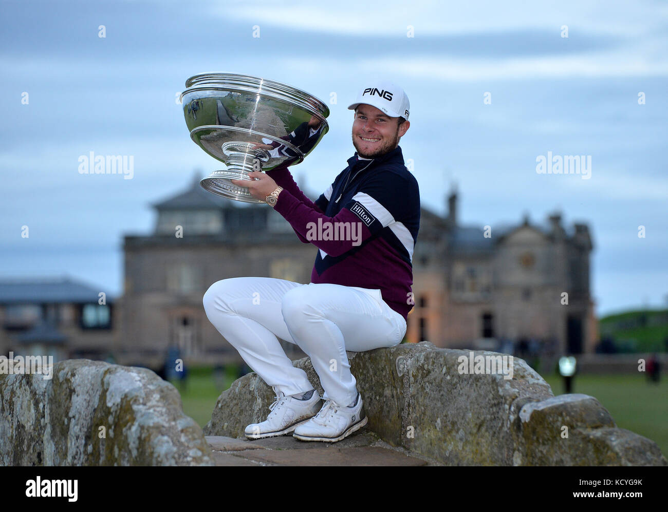 England's Tyrrell Hatton poses with the trophy on the Swilken bridge after winning during day four of the Alfred Dunhill Links Championship at St Andrews Old Course, Fife. Stock Photo