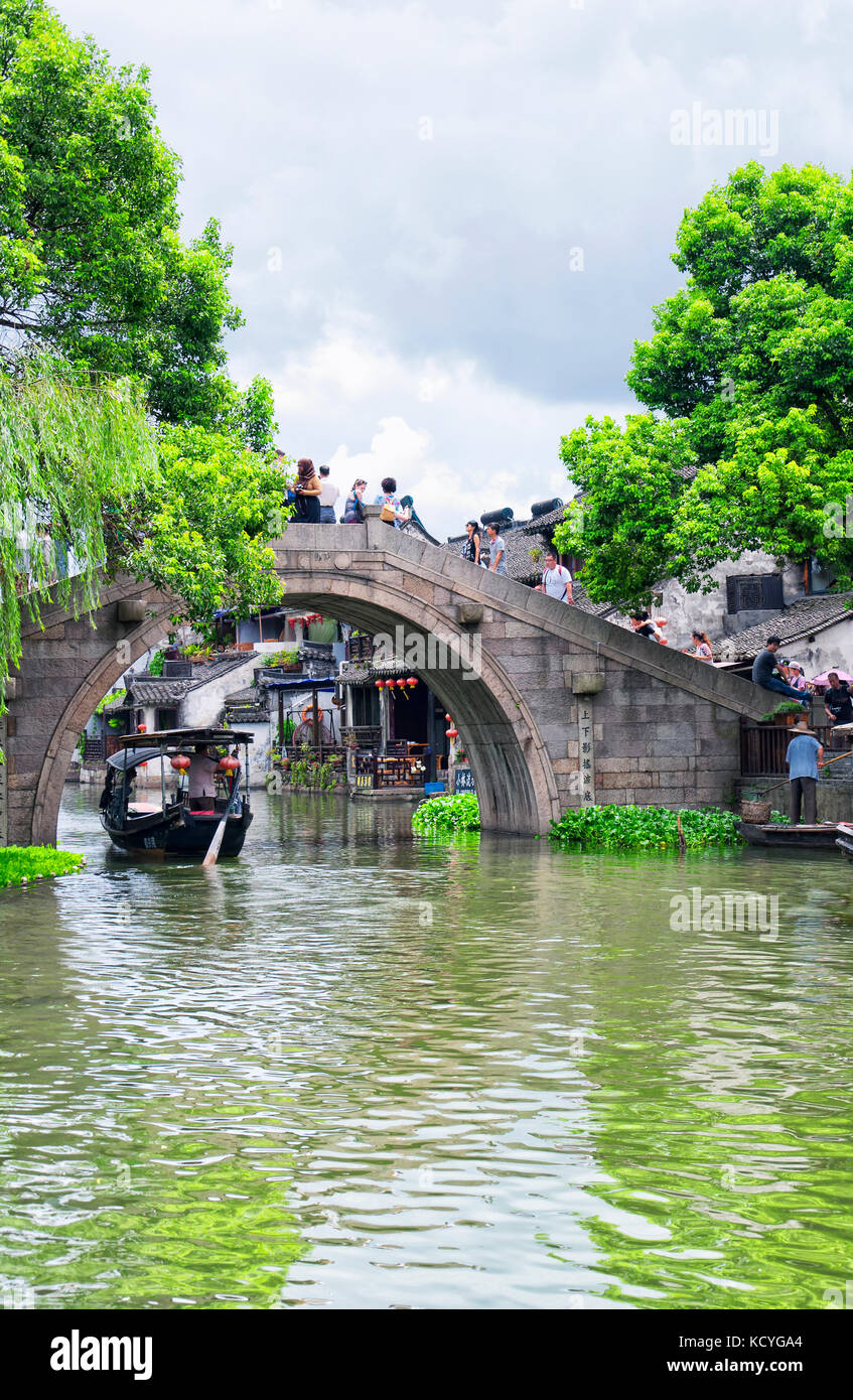 Chinese style buildings and a bridge crossing the water canals of Xitang town in Jiashan county in Zhejiang province China. Stock Photo