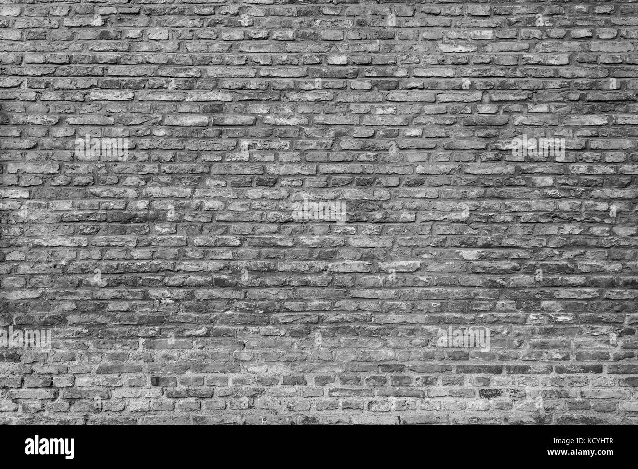 Old and aged brick wall texture background in black and white. Stock Photo