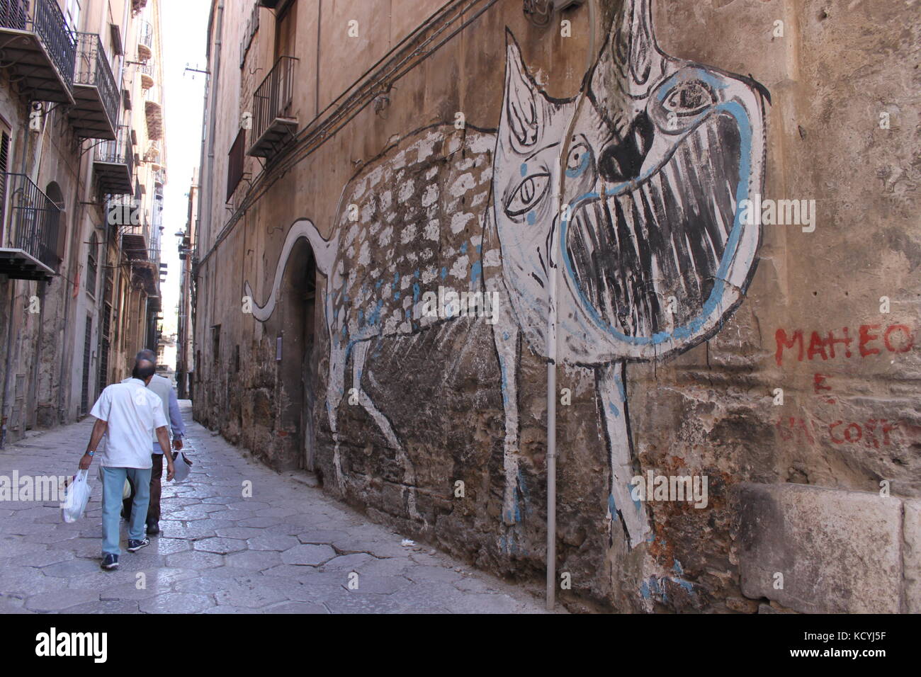 Scary wall art of a monster in an italian alley Stock Photo Alamy