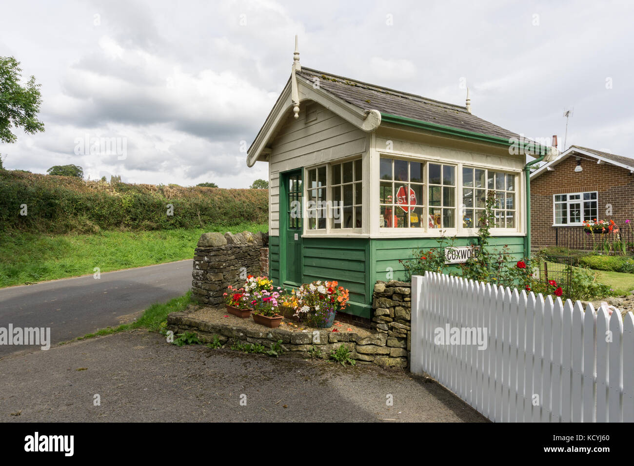 Old railway signal box in the North Yorkshire village of Coxwold; now part of an adjoining residential property. Stock Photo