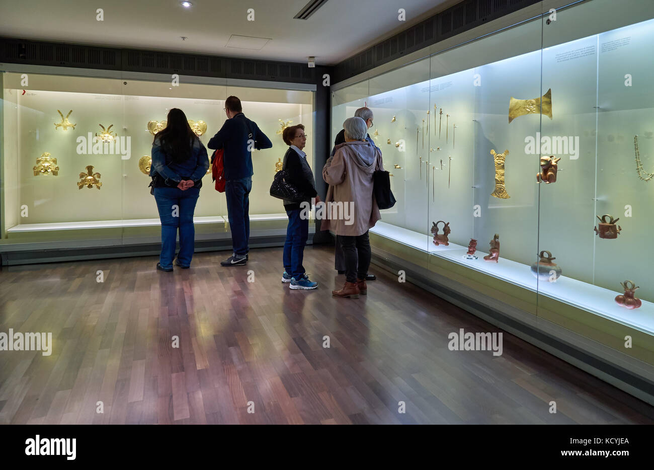 tourists looking in cabinet in exhibition room of Gold Museum or Museo del Oro, Bogota, Colombia, South America Stock Photo