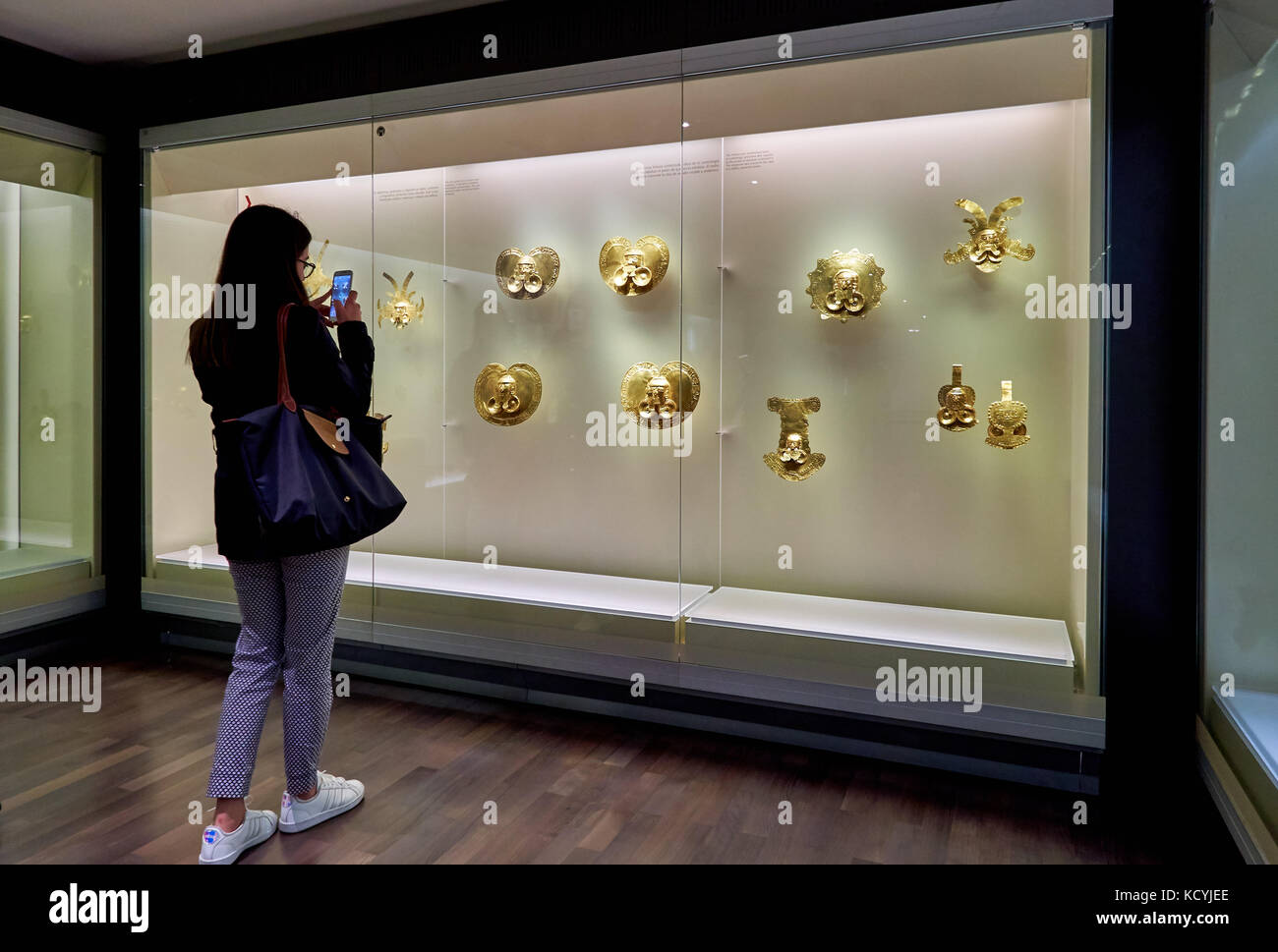 tourists looking in cabinet in exhibition room of Gold Museum or Museo del Oro, Bogota, Colombia, South America Stock Photo
