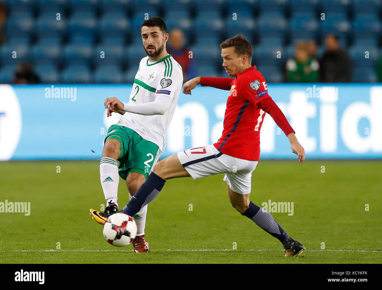 Northern Ireland's Conor McLaughlin (left) and Norway's Martin Linnes in action during the 2018 FIFA World Cup Qualifying Group C match at the Ullevaal Stadion, Oslo. Stock Photo