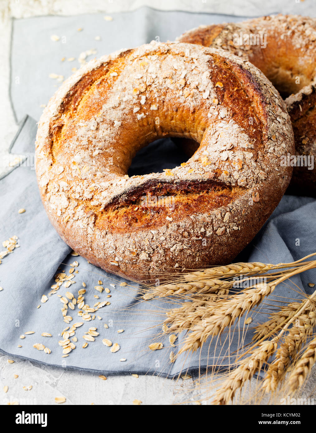 Bread with seeds on stone background. Copy space. Stock Photo