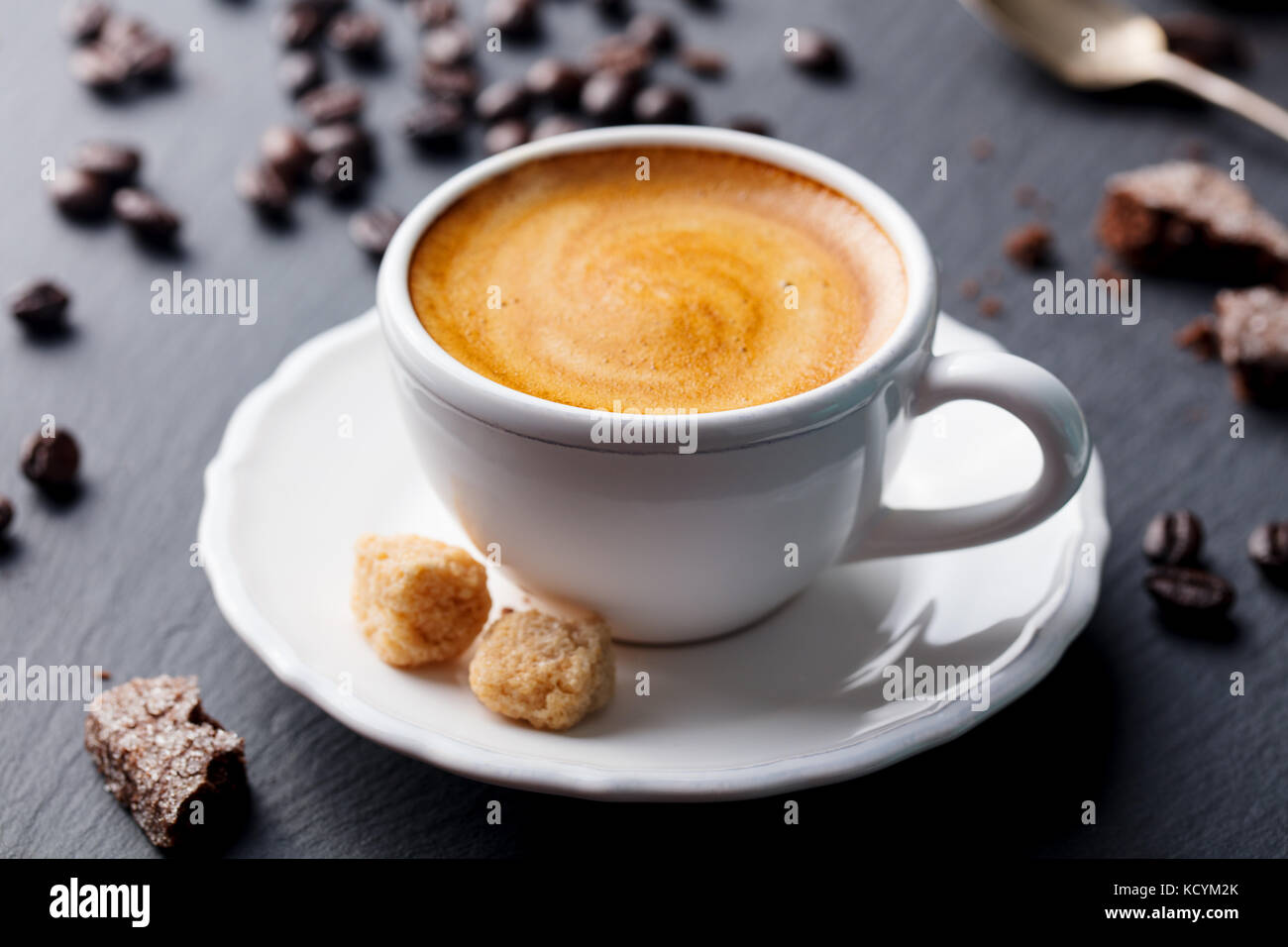 Coffee espresso in white cup on black slate background. Stock Photo