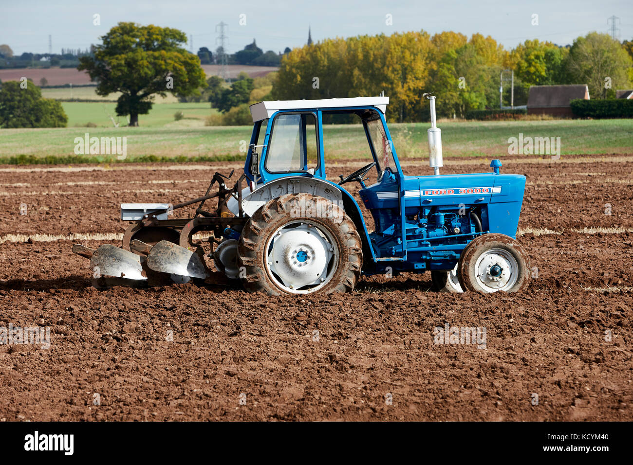 Ford 3000 Tractor Ploughing Stubble Field UK - Stock Image