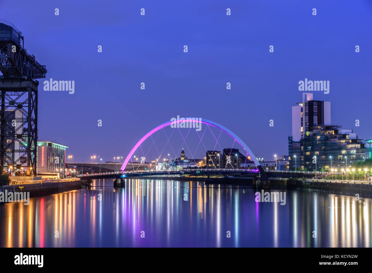GLASGOW, SCOTLAND - AUGUST 15, 2017 - Night lights and the Clyde Arc Bridge at Glasgow City in Scotland over river. Stock Photo