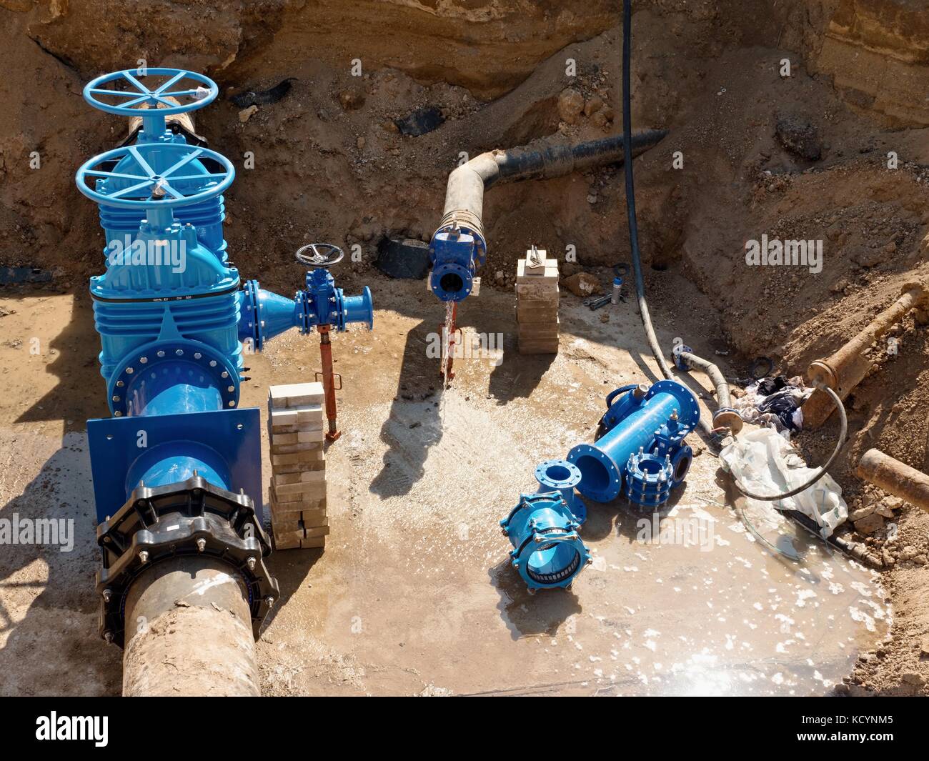 Oil, gas, water industry. Wellhead with valve armature underground. Dug