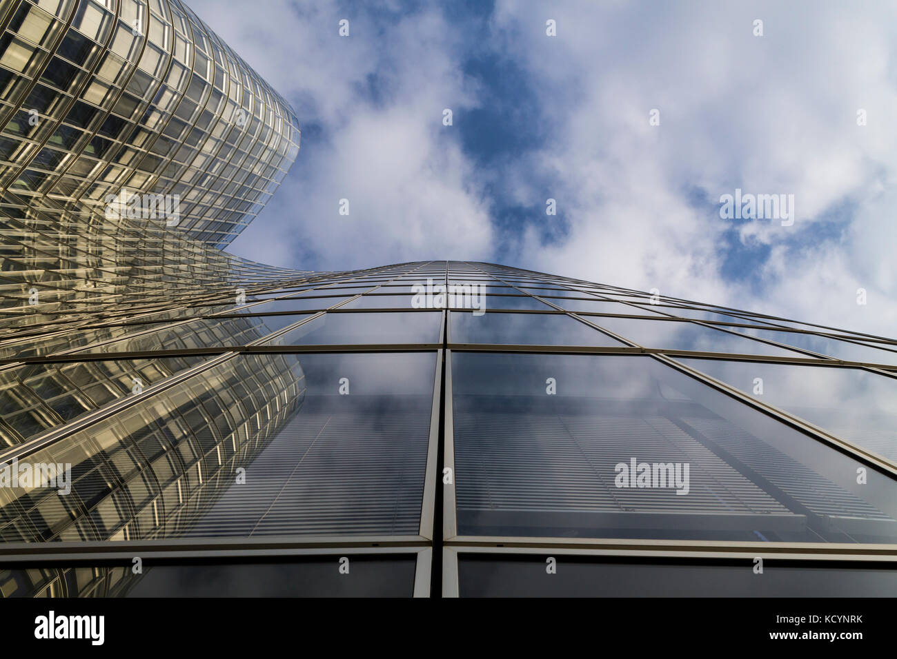 Glass modern building on a blue cloudy sky Stock Photo - Alamy