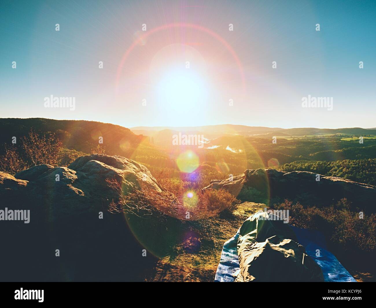 Beautiful awakening in rocks. Sleeping in nature in sleeping bag. View