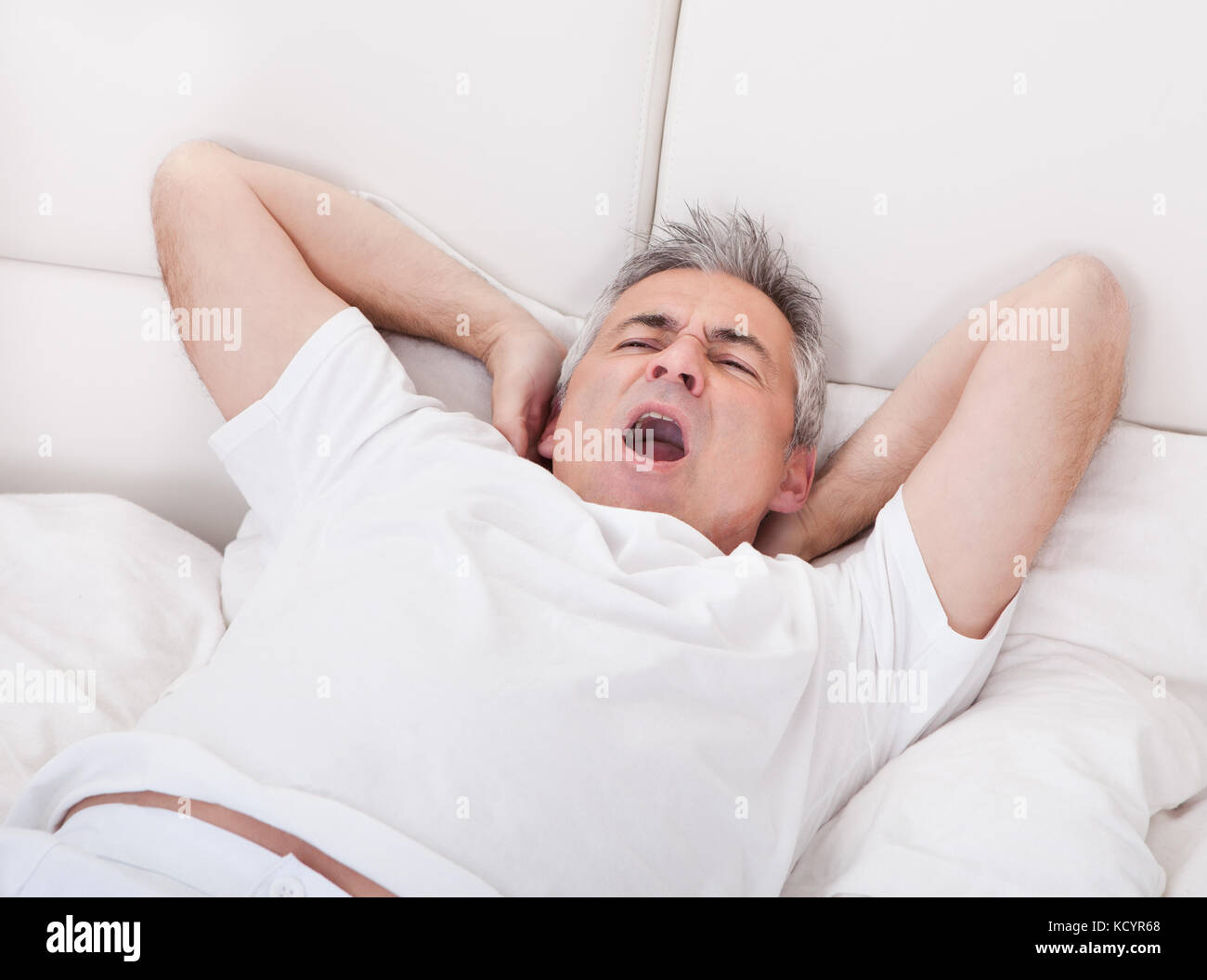 Yawning mouth in bed hi-res stock photography and images - Alamy