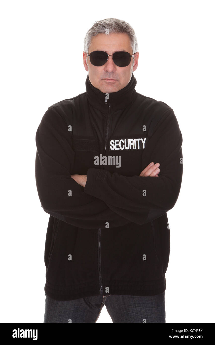 Mature security man standing over white background Stock Photo