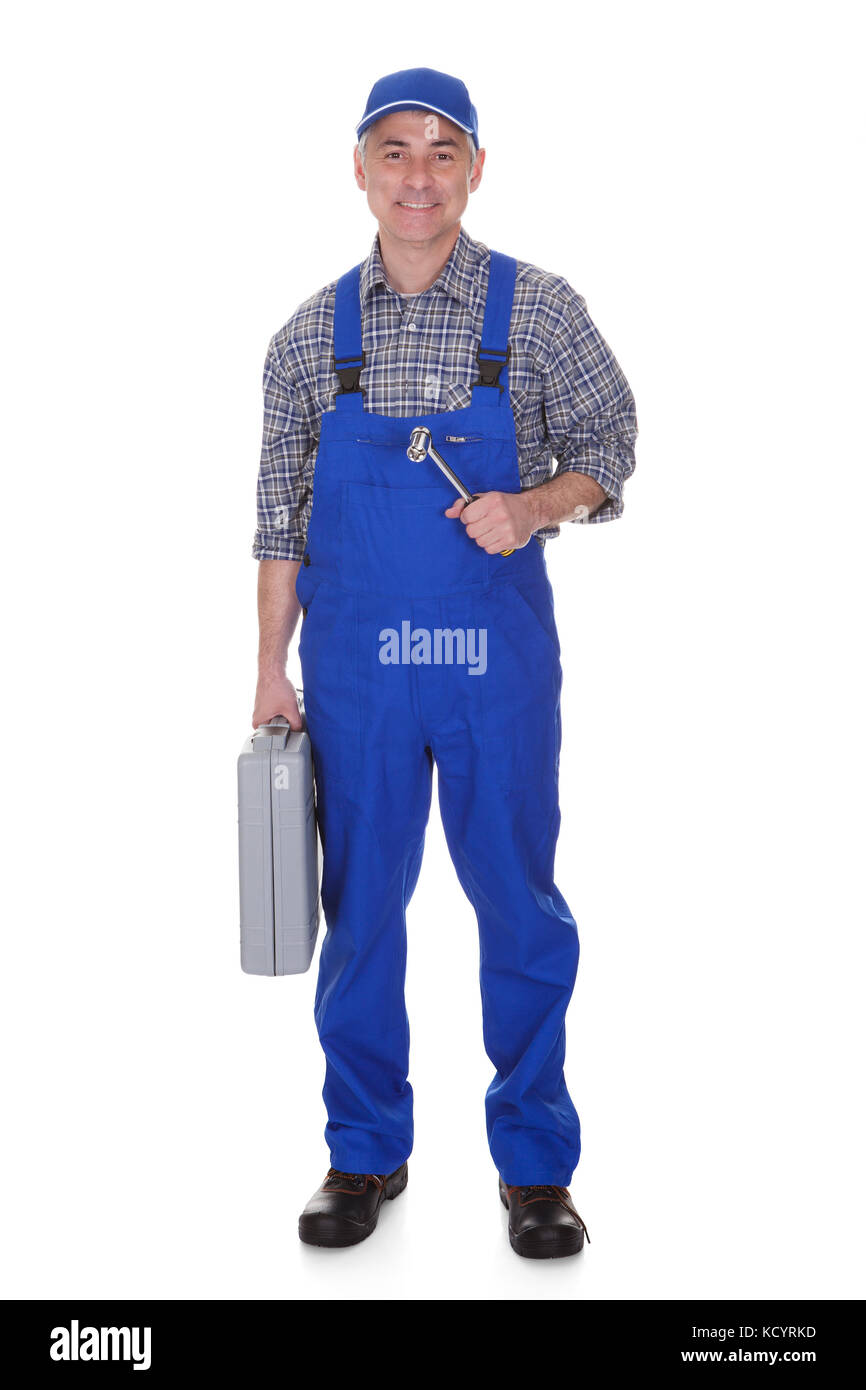 Mature Male Technician Holding Worktool Over White Background Stock Photo