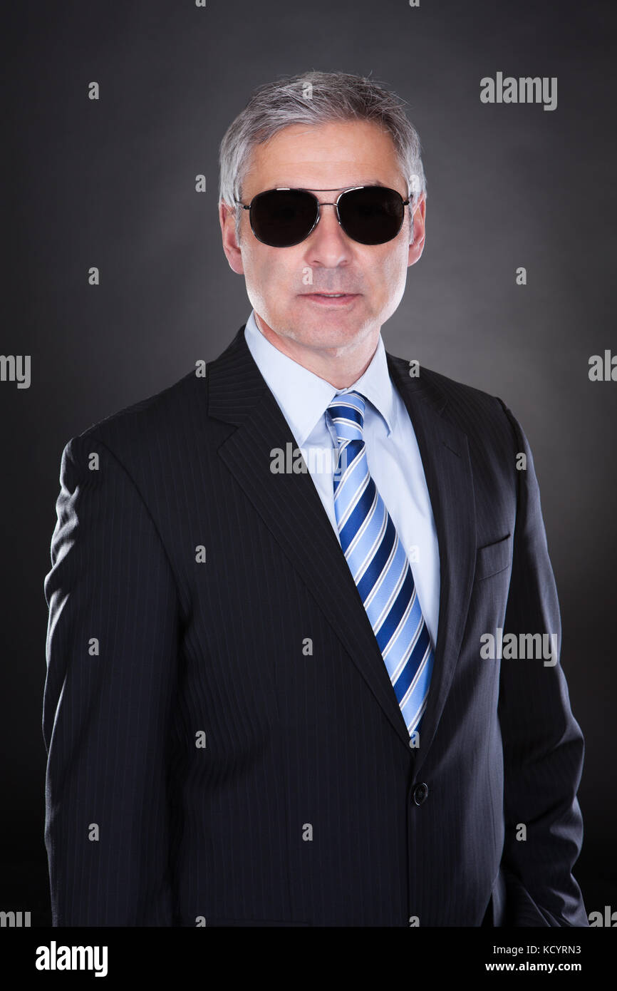 Portrait Of Male Body Guard Over Black Background Stock Photo Alamy