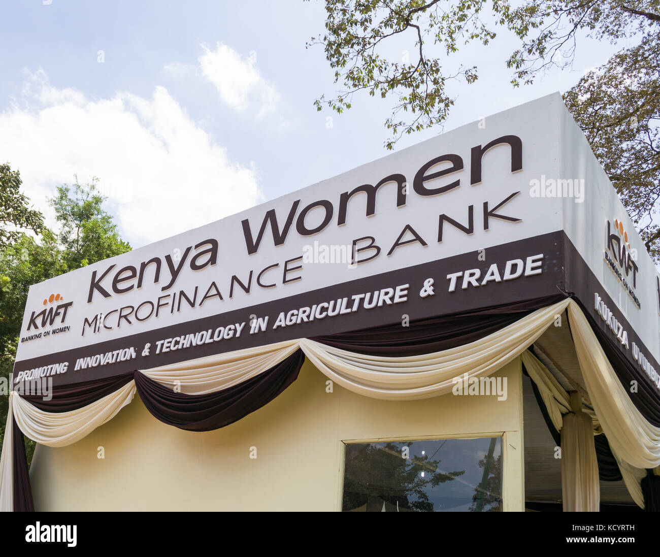 Kenya Women Microfinance Bank KWFT sign, Nairobi International Trade Fair, Kenya Stock Photo