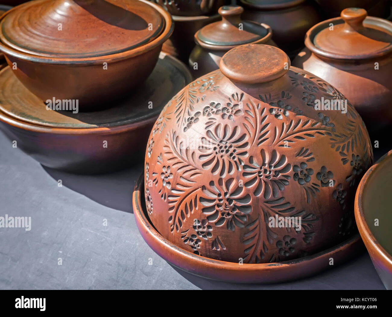 A variety of ceramic dishes with a beautiful design on the storefront