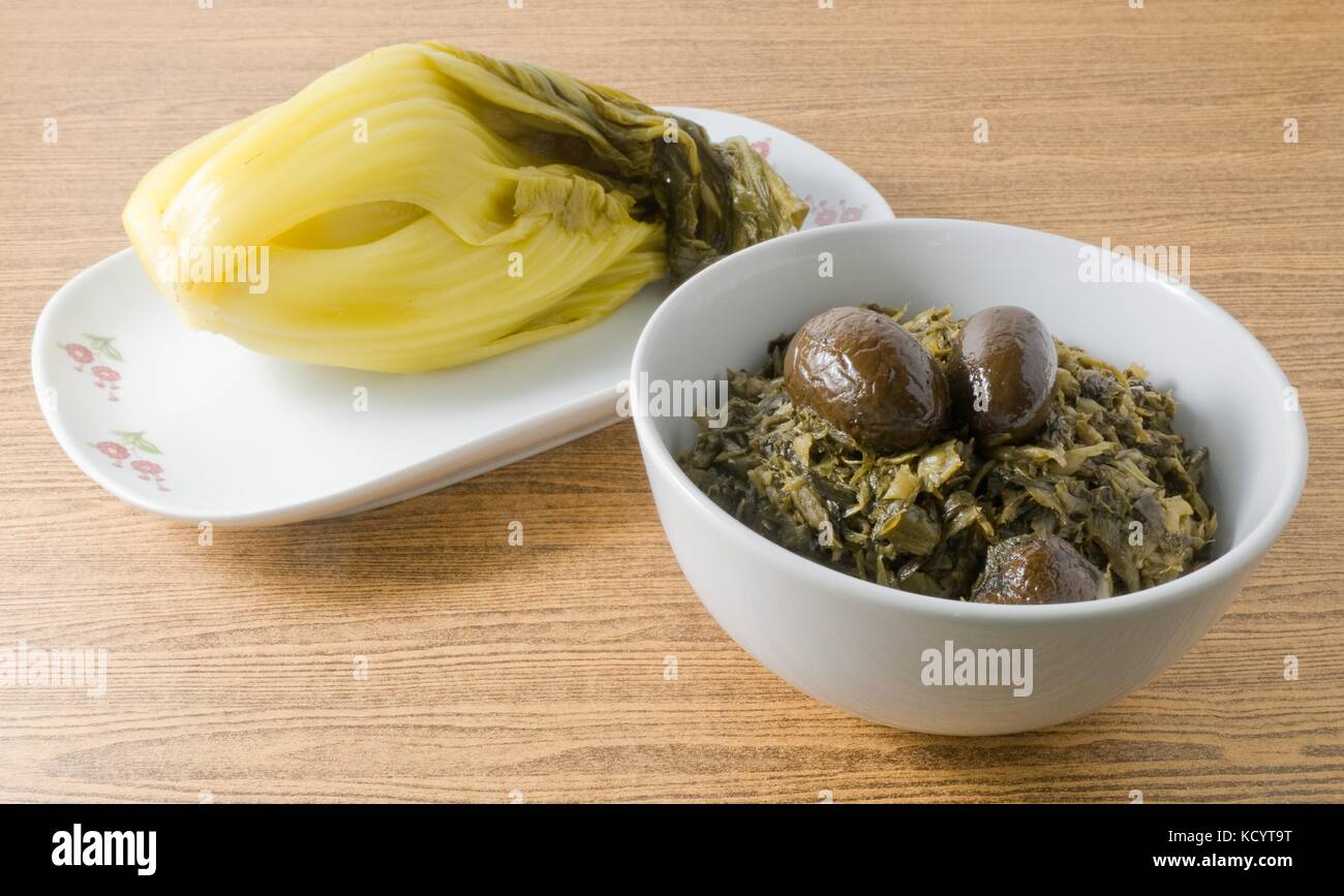 Chinese Traditional Food, Chopped Pickled Chinese Cabbage with Chinese Olives in A Bowl. Stock Photo