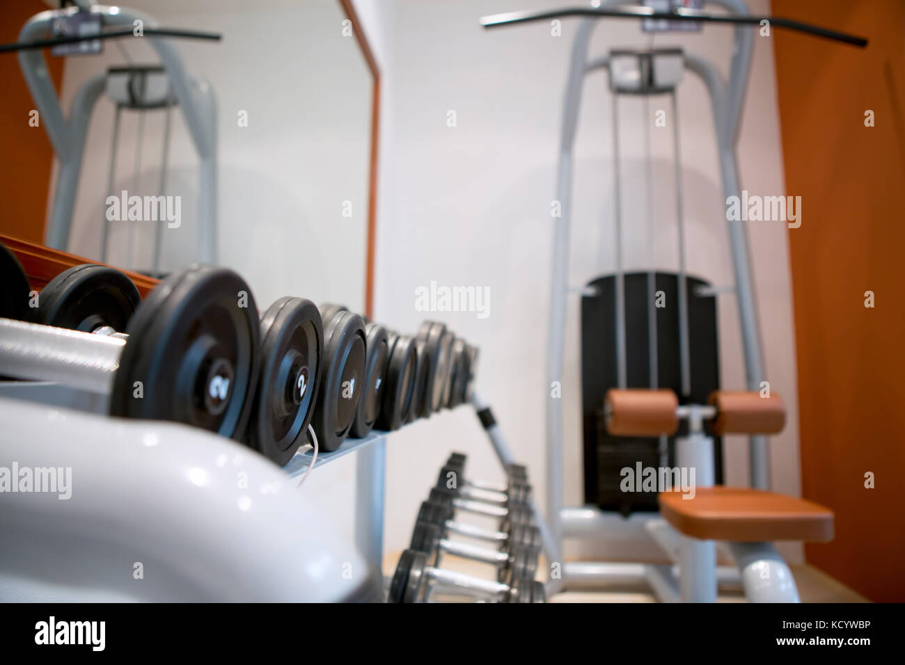 Weights, many black dumbbell in fitness room at gym Stock Photo