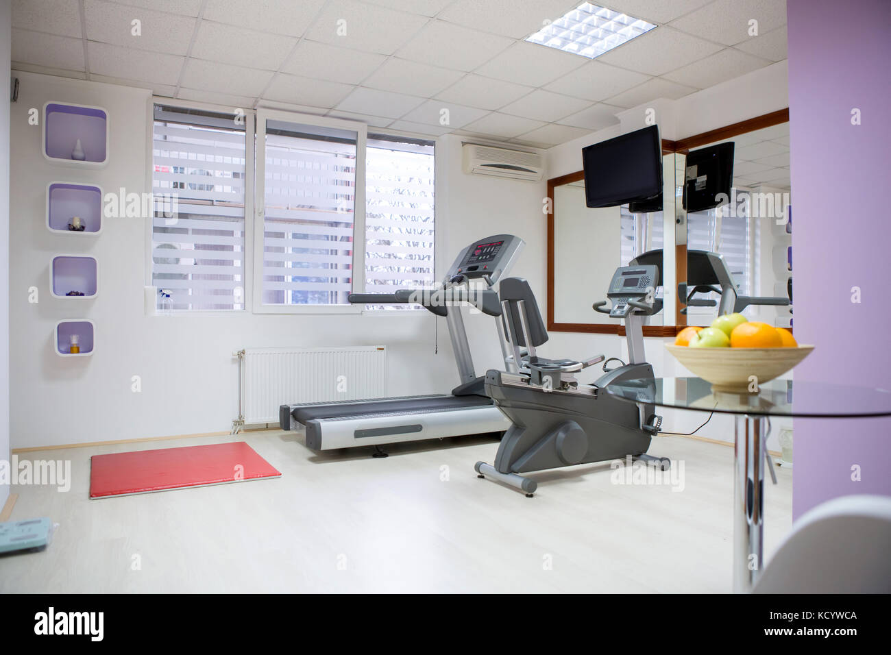 modern gym in leisure center with mirror wall and fitness machines Stock Photo