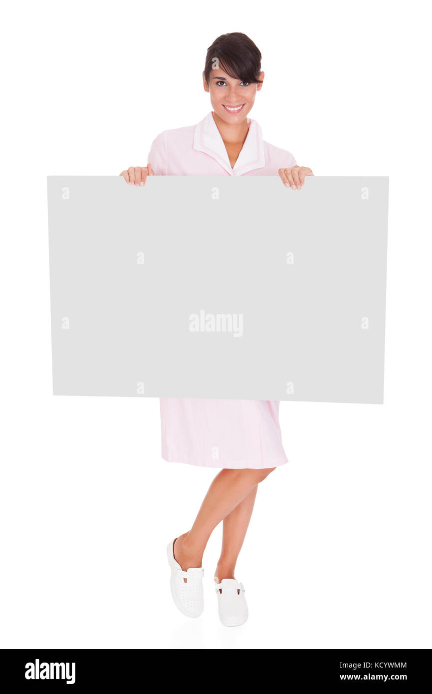 Young Happy Maid With Empty Bill Board Over White Background Stock Photo